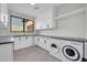 Efficient laundry room with modern appliances, ample counter space, and natural light at 6331 E Phoenician Blvd # 6, Scottsdale, AZ 85251
