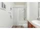 Bathroom featuring a shower and tub combination with a gray and white shower curtain at 7445 S 30Th Ter, Phoenix, AZ 85042