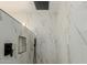 Luxurious walk-in shower with rainfall shower head and modern black fixtures at 7807 E Palm Ln, Scottsdale, AZ 85257
