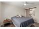 Comfortable bedroom featuring ceiling fan and closet with sliding door at 7807 E Palm Ln, Scottsdale, AZ 85257