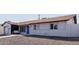 Home with a manicured gravel yard and a stylish concrete walkway to the vibrant blue front door at 7807 E Palm Ln, Scottsdale, AZ 85257