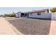 Charming home with a well-manicured gravel yard and a stylish concrete walkway to the entrance at 7807 E Palm Ln, Scottsdale, AZ 85257