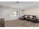 The spacious living room features wood-look tile flooring, a new door and recessed lighting at 7807 E Palm Ln, Scottsdale, AZ 85257