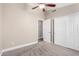 Bedroom featuring carpet, ceiling fan, neutral walls and closet with mirrored sliding doors at 8910 W Lockland Ct, Peoria, AZ 85382