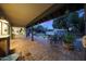 This covered brick patio is perfect for entertaining, with outdoor seating and a tranquil backyard view at 9621 N 83Rd Way, Scottsdale, AZ 85258