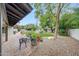 Beautiful backyard featuring mature trees, manicured landscaping, garden, and a water feature at 9621 N 83Rd Way, Scottsdale, AZ 85258