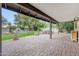 Spacious covered patio with brick pavers and views of a landscaped backyard with a water feature at 9621 N 83Rd Way, Scottsdale, AZ 85258