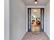 Elegant entryway with a decorative wrought iron door offers a glimpse into the inviting living space at 9621 N 83Rd Way, Scottsdale, AZ 85258