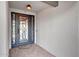 The entryway boasts a wrought iron door and brick floors for a warm welcome at 9621 N 83Rd Way, Scottsdale, AZ 85258