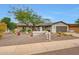 Charming single-story home with desert landscaping, painted facade, and a two-car garage at 9621 N 83Rd Way, Scottsdale, AZ 85258