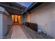 Inviting front entrance with a stylish door, stone pathway, and charming decorative planters at 9621 N 83Rd Way, Scottsdale, AZ 85258