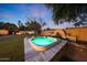Backyard hot tub with desert landscaping and a privacy wall, perfect for relaxing at 9621 N 83Rd Way, Scottsdale, AZ 85258