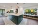 Kitchen island with barstool seating and decorative black and white tile at 9621 N 83Rd Way, Scottsdale, AZ 85258