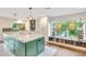 Spacious kitchen featuring a large center island, modern appliances, and built-in nook at 9621 N 83Rd Way, Scottsdale, AZ 85258