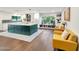 Stylish kitchen with a large island, white cabinetry, and a cozy seating area at 9621 N 83Rd Way, Scottsdale, AZ 85258