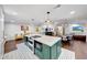 Spacious open kitchen with an island featuring a cooktop and built-in oven at 9621 N 83Rd Way, Scottsdale, AZ 85258