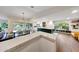 Open concept kitchen and dining area with backyard views and modern finishes at 9621 N 83Rd Way, Scottsdale, AZ 85258