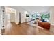 Bright living room features hardwood floors, a fireplace, and an open floor plan at 9621 N 83Rd Way, Scottsdale, AZ 85258