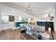 Open concept living space featuring a large dining table and kitchen island at 9621 N 83Rd Way, Scottsdale, AZ 85258