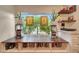 Charming office nook with a view, built-in shelves, and natural light at 9621 N 83Rd Way, Scottsdale, AZ 85258