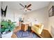 Bright office space with hardwood floors, a modern desk, and a plant for a touch of nature at 9621 N 83Rd Way, Scottsdale, AZ 85258