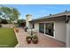 Outdoor patio area featuring a grill, dining table, and decorative potted plants, ideal for enjoying al fresco meals at 9621 N 83Rd Way, Scottsdale, AZ 85258