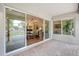 A spacious patio extends from the home offering views of a garden, outdoor seating and mature plants at 9621 N 83Rd Way, Scottsdale, AZ 85258