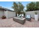 Charming backyard patio with a modern fire pit and comfortable seating, perfect for evening relaxation at 9621 N 83Rd Way, Scottsdale, AZ 85258