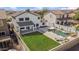 Aerial view of a private backyard featuring a pool, lush lawn, and outdoor living space at 9712 E Tangerine Rd, Florence, AZ 85132