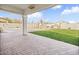 Expansive backyard with brick patio, and lush green lawn at 9712 E Tangerine Rd, Florence, AZ 85132