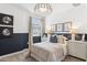 Stylishly decorated bedroom with a neutral color scheme, accent wall, and complementary furnishings at 9835 S 11Th St, Phoenix, AZ 85042