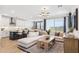Bright living room showcases modern finishes and stylish decor, seamlessly connected with the kitchen and dining area at 9835 S 11Th St, Phoenix, AZ 85042