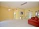 Bright and open living room with neutral tones, carpet, and view into hall at 10334 W Highwood Ln, Sun City, AZ 85373