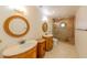 Elegant bathroom boasts dual sinks, a glass enclosed shower, and stylish finishes at 10421 N 77Th Pl, Scottsdale, AZ 85258