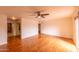 Generous bedroom with wood floors, ceiling fan, closet, and natural light at 10421 N 77Th Pl, Scottsdale, AZ 85258