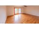 An airy room features a ceiling fan, and sliding doors leading to a private balcony at 10421 N 77Th Pl, Scottsdale, AZ 85258