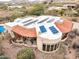 Expansive desert home featuring terracotta roof, solar panels, private pool, and covered patio with gym equipment at 10955 E Vista Del Cielo Rd, Gold Canyon, AZ 85118