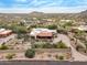 An aerial view of the property and neighborhood showcasing the surrounding landscape and homes at 10955 E Vista Del Cielo Rd, Gold Canyon, AZ 85118