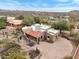 High aerial view of the property showing landscaping, tile roof, and surrounding desert terrain at 10955 E Vista Del Cielo Rd, Gold Canyon, AZ 85118