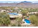 Home with pool and solar panels with view of mountain range at 10955 E Vista Del Cielo Rd, Gold Canyon, AZ 85118