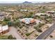 High aerial showing a home, pool, lush desert landscape, and mountain views at 10955 E Vista Del Cielo Rd, Gold Canyon, AZ 85118