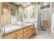 Well-lit bathroom featuring double sinks with granite countertops and framed art at 10955 E Vista Del Cielo Rd, Gold Canyon, AZ 85118