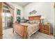 Bedroom featuring a wood bed, natural light, and a built-in desk area at 10955 E Vista Del Cielo Rd, Gold Canyon, AZ 85118