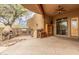 Expansive covered patio featuring an outdoor kitchen with a grill, oven, and ample counter space at 10955 E Vista Del Cielo Rd, Gold Canyon, AZ 85118