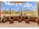 Inviting outdoor patio with comfortable seating and scenic views of the surrounding desert landscape at 10955 E Vista Del Cielo Rd, Gold Canyon, AZ 85118