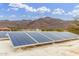 Rooftop solar panels providing energy efficiency and mountain views in the distance at 10955 E Vista Del Cielo Rd, Gold Canyon, AZ 85118