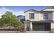 Two-story home featuring an attached garage and desert landscaping in a serene, scenic neighborhood at 1119 E Mcneil St, Phoenix, AZ 85042