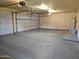 Open garage with plenty of space for multiple vehicles and additional storage options at 1119 E Southshore Dr, Gilbert, AZ 85234