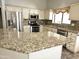 Granite countertops, stainless steel appliances, and ample cabinetry in this well-appointed kitchen at 1119 E Southshore Dr, Gilbert, AZ 85234