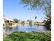 Scenic view of the lake with fountain and lush landscaping, perfect for relaxing by the water at 1119 E Southshore Dr, Gilbert, AZ 85234